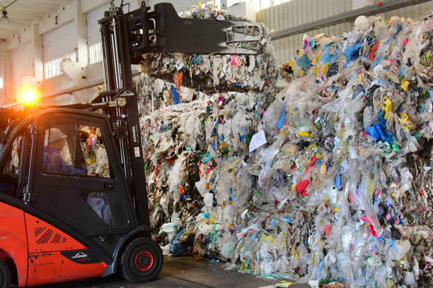 04 February 2020, Saxony-Anhalt, Merseburg: At the Merseburger APK AG bales of plastic waste are transported in a hall. The company produces high quality plastic granules from production and household plastic waste. Photo: Waltraud Grubitzsch/dpa-Zentralbild/ZB (Photo by Waltraud Grubitzsch/picture alliance via Getty Images)