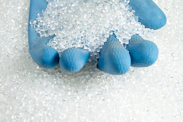 showing transparent plastic raw materials with glove